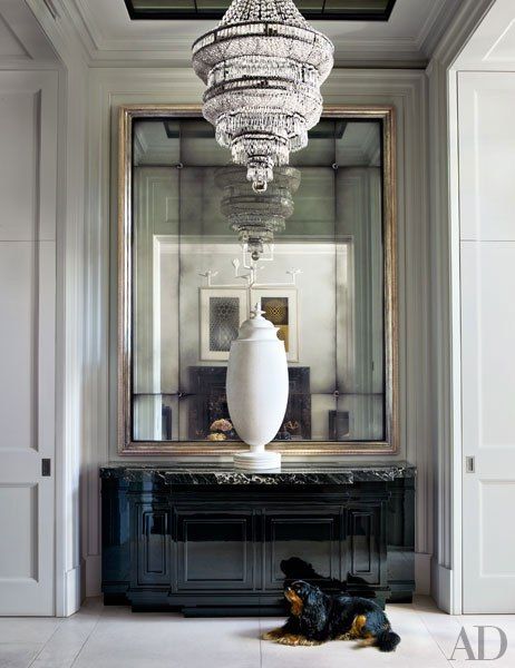 A 1940s plaster urn graces the entrance hall of a stately London townhouse by designer Hubert Zandberg