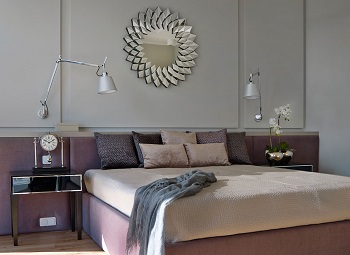 bedroom with designer hanging mirror